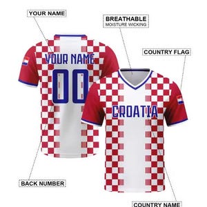 May include: Two Croatia football shirts. The front shirt has the word "CROATIA" in blue. The shirts are white and red checkered with blue accents. The back shirt has the text "YOUR NAME" and the number "00". The shirts are labeled "BREATHABLE MOISTURE WICKING".