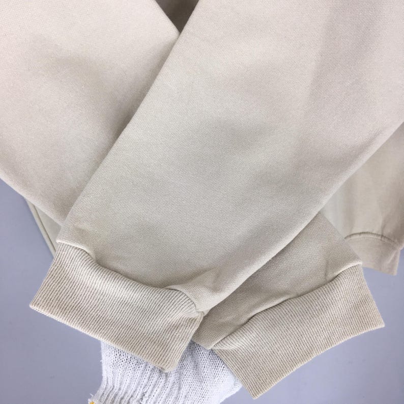 May include: A rustic wooden sign with the text "Welcome to our home" in white lettering. The sign has a distressed finish and a simple, inviting design, suitable for a front porch or entryway.