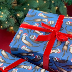 Otters Christmas wrapping paper - cute otters santa hats