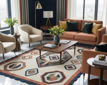 May include: A living room with a patterned rug featuring geometric designs in orange, green, and blue. The room includes a sofa, armchairs, and a coffee table, creating a stylish interior. The rug's dimensions are approximately 200 cm x 300 cm.