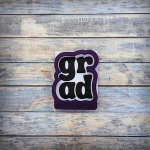 May include: A white ceramic mug with a black handle and the text "But First, Coffee" in a handwritten style. The mug is on a white surface. The mug is 4 inches tall.