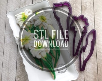 May include: A white ceramic plate with a bouquet of white lilies and green leaves. A purple plastic cookie cutter in the shape of a lily is on a wooden surface. The text "STL FILE DOWNLOAD" is in the center of the image.