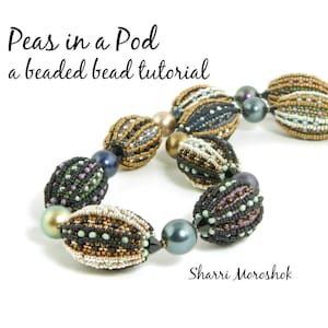 May include: A beaded necklace with a variety of colors, including black, gold, green, and purple. The beads are arranged in a pattern that resembles peas in a pod. The necklace is titled "Peas in a Pod a beaded bead tutorial" and is attributed to "Sharri Moroshok".