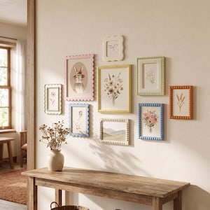 May include: A gallery wall arrangement featuring nine rectangular picture frames in various pastel colors including pink, yellow, blue, green, and orange. The frames have scalloped or beaded edges and contain illustrations of animals and flowers.