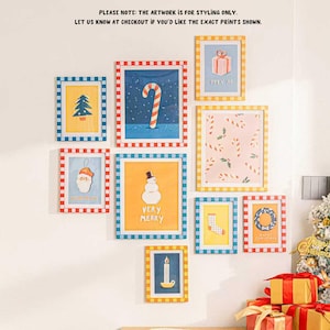 May include: A collection of framed Christmas-themed art prints. The prints feature festive illustrations like a candy cane, snowman, gift box, and Christmas tree. Each frame has a colorful checkered border. Text on the prints includes "VERY MERRY" and "OPEN ME".