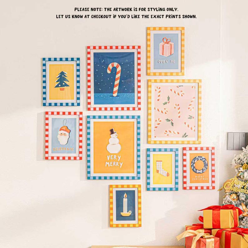 May include: A collection of framed Christmas-themed art prints. The prints feature festive illustrations like a candy cane, snowman, gift box, and Christmas tree. Each frame has a colorful checkered border. Text on the prints includes "VERY MERRY" and "OPEN ME".