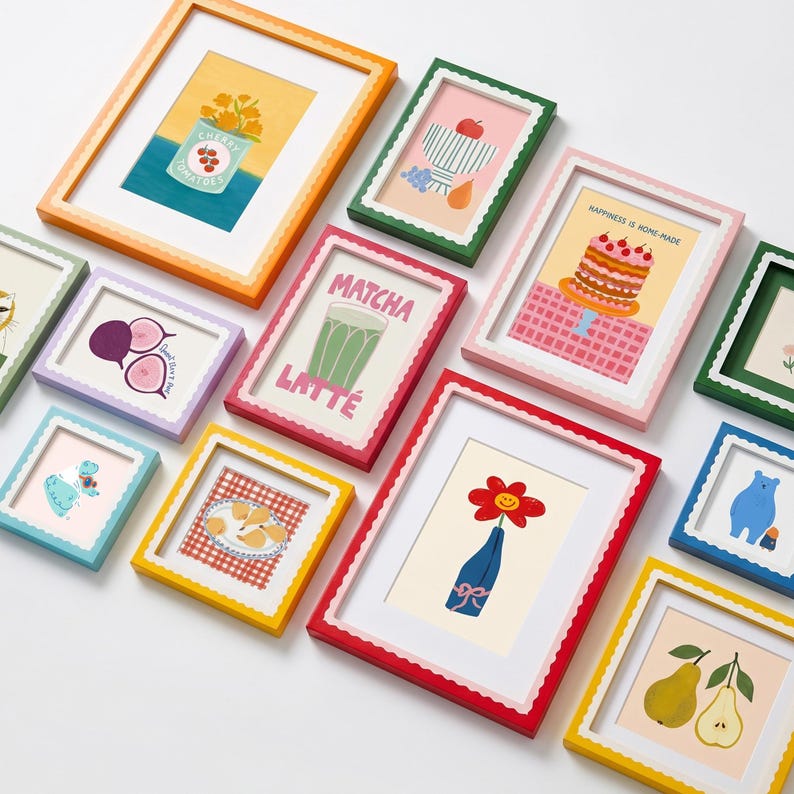 May include: A collection of various rectangular wall frames in vibrant colors including orange, green, pink, red, yellow, and blue, each featuring a scalloped inner edge and white matting, displaying diverse illustrations of food, flowers, and animals.