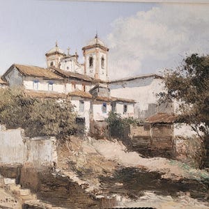 May include: An oil painting depicts a historic church with multiple bell towers and white walls. The buildings have brown tile roofs and are surrounded by lush greenery and a light blue sky. The artwork is signed in the lower left corner.