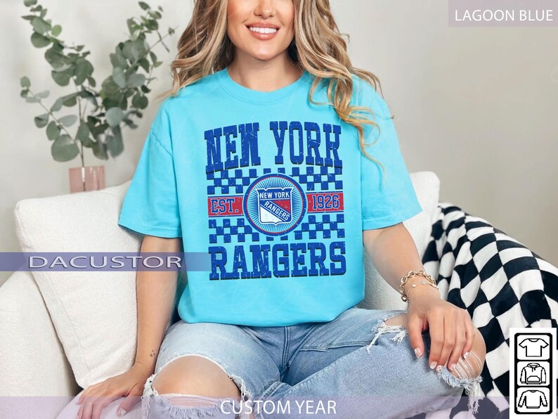 May include: Lagoon blue t-shirt featuring the text "NEW YORK RANGERS" with a team logo and "EST. 1926". The shirt has a checkered pattern and is a custom year design.