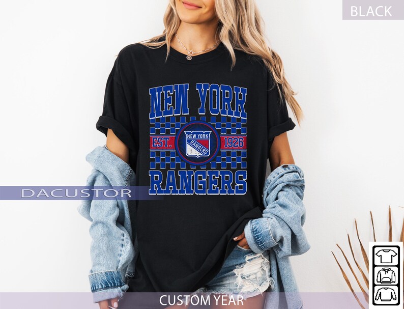 May include: Black t-shirt featuring the text "NEW YORK RANGERS" in blue, with a team logo and "EST. 1926". The shirt has a classic design, perfect for fans of the hockey team. The shirt is a comfortable fit.