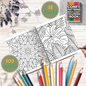 May include: An open adult coloring book with intricate black and white patterns, featuring a mandala and tropical leaves. The book is accompanied by a set of colored pencils. The cover reads "Comfy Patterns Bold & Easy Coloring Book". The book has 100 pages and 38 covers.