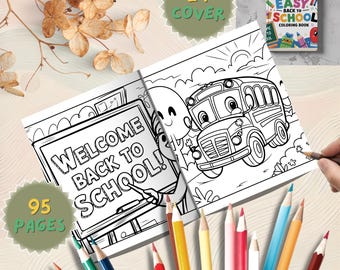 May include: An open coloring book with a school bus illustration and the text "WELCOME BACK TO SCHOOL!" is surrounded by colored pencils. The cover of the book reads "BOLD EASY BACK TO SCHOOL COLORING BOOK". The book has 95 pages and 24 covers.
