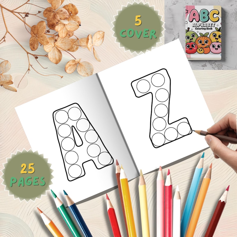 May include: An open alphabet colouring book with the letters "A" and "Z" outlined with circles. The book is open to two pages, with a hand holding a pencil. The cover reads "ABC Alphabet Colouring Book". Colouring pencils are scattered around the book. The cover says "5 COVER" and "25 PAGES".