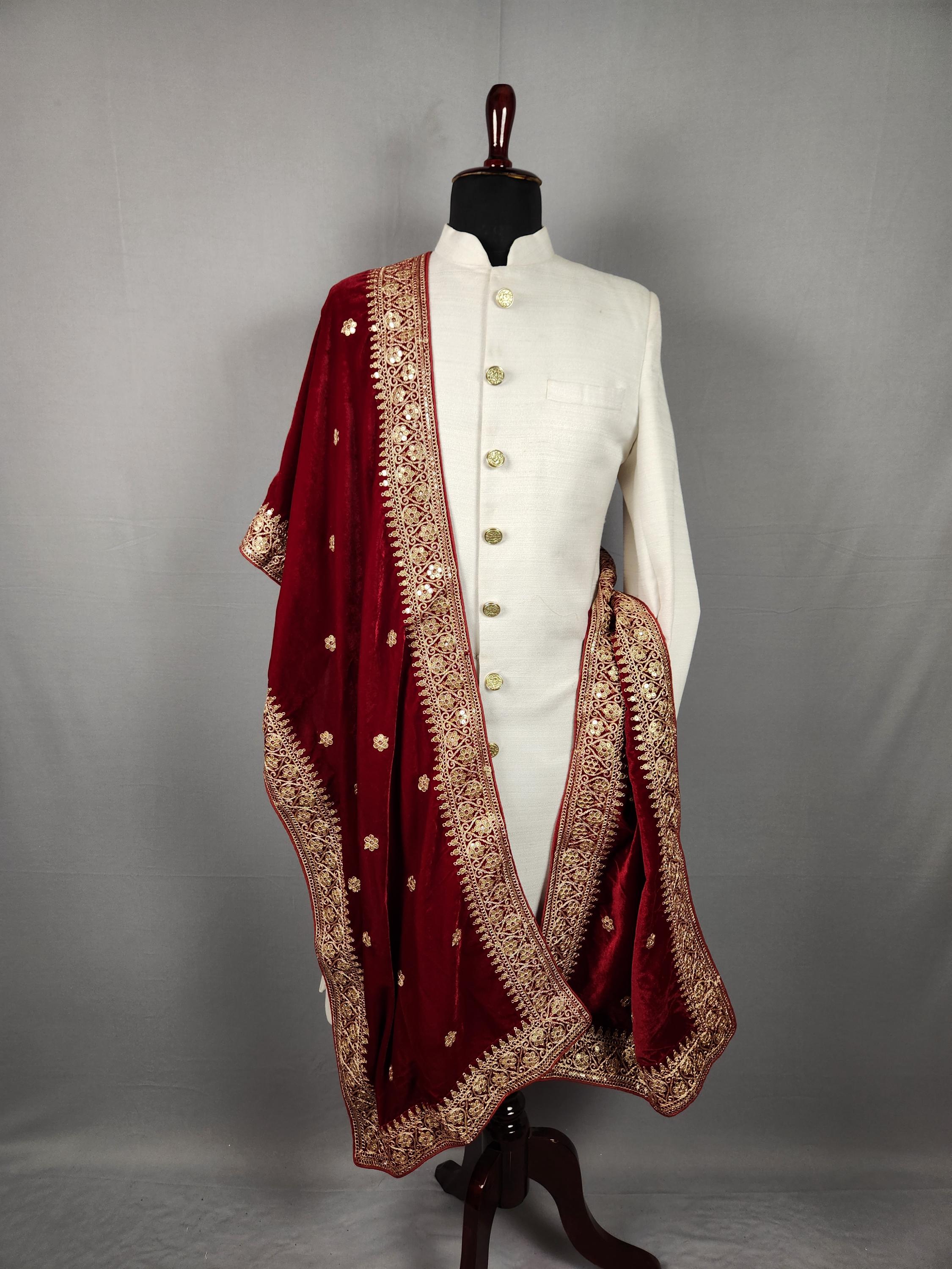 white sherwani with red shawl