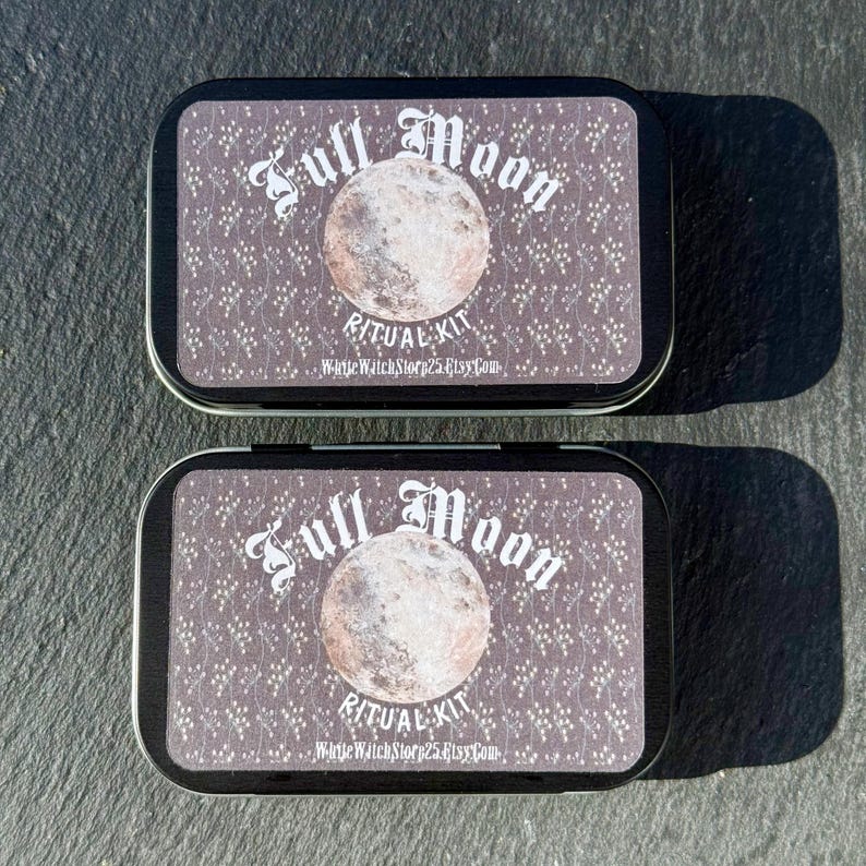 May include: Two rectangular tins with lids, each featuring a design for a Full Moon Ritual Kit. The lids have a patterned background with a full moon illustration and the text "Full Moon Ritual Kit". The text "WhiteWatchStory25.Etsy.Com" is also visible.