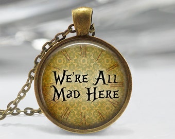 Alice In Wonderland Necklace We're All Mad Here Literary Quotes Cheshire Cat Art Pendant in Bronze or Silver with Chain Included