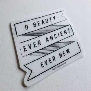 May include: White sticker with black text that reads "O Beauty Ever Ancient Ever New" with a website address at the bottom.
