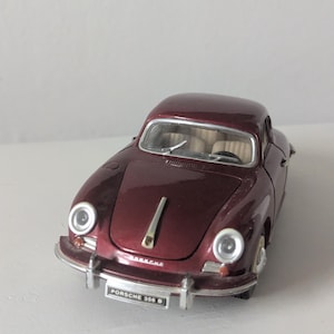 May include: A set of three ceramic mugs with a speckled, matte finish. The mugs are in shades of cream, light gray, and dark gray. Each mug has a simple, minimalist design, perfect for coffee or tea.