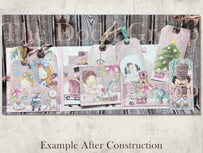 May include: A set of eight pink and white Christmas-themed gift tags with various illustrations, including a ballerina, a nutcracker, a rocking horse, a snow globe, and a Christmas tree. The tags are decorated with glitter and have a rustic wood background.