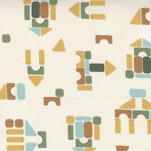 May include: A white fabric with a repeating pattern of colorful building blocks. The blocks are in various shapes and sizes, including squares, rectangles, triangles, and arches. The colors are brown, green, yellow, and blue.