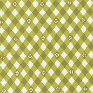May include: A green and white checkered fabric with a pattern of small white flowers with orange centers.