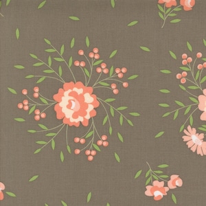 May include: A brown fabric with a repeating pattern of coral pink flowers and green leaves. The flowers have a white center and are surrounded by small coral pink berries.