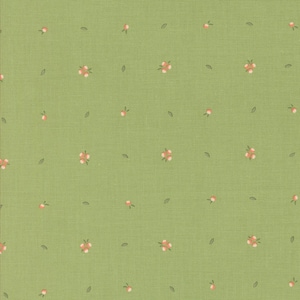 May include: A green fabric with a repeating pattern of small pink flowers. The fabric has a subtle texture.