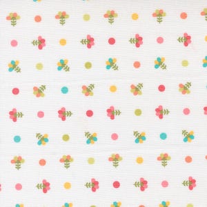 May include: White fabric with a repeating pattern of small, stylized flowers and dots. The flowers are in shades of pink, yellow, and blue-green, with green stems. The dots are in pink, yellow, green, and blue-green.