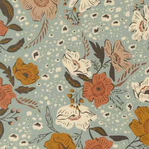 May include: A fabric pattern featuring a light blue background with a scattered design of white, rust orange, and muted pink flowers. The floral print includes dark brown leaves and stems, interspersed with small, irregular white spots throughout.