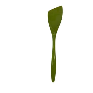 May include: A solid olive green kitchen spatula with a smooth, glossy finish. The utensil features a long, slender handle that transitions into a wide, asymmetrical head with a pointed corner, designed for scraping and mixing in cookware.