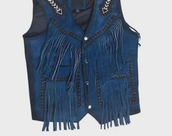 May include: A blue suede vest with fringe detailing. The vest features white stitching and black trim. The front has a button closure and decorative fringe. The vest has a classic western style.