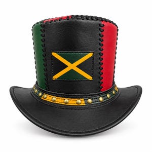 May include: A black leather top hat featuring vertical panels of green and red, accented with black whipstitch detailing. The front displays a rectangular patch with a yellow saltire on a green background, and the brim base has gold studs.