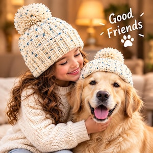 Textured crochet beanie pattern showing a detailed cream winter hat with colorful blue and golden accents and a large pom pom, ideal for a crochet winter beanie pattern PDF, textured crochet hat pattern PDF, and handmade crochet project.