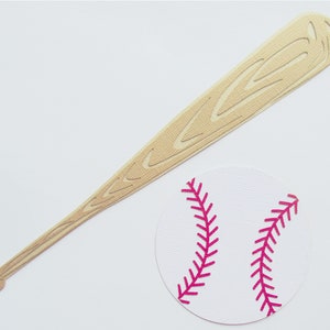 May include: A wooden baseball bat with a white baseball with pink stitching.
