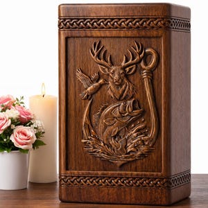 May include: A wooden urn with a carved relief depicting a deer, fish, and bird, with a fishing hook design. The urn is brown and has a decorative border. A lit candle and a small pot of pink roses are next to the urn.