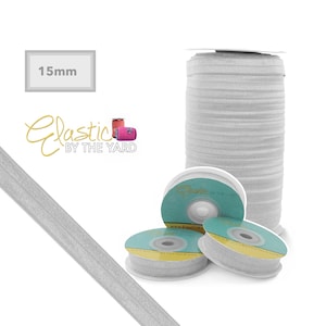 May include: A roll of 15mm wide silver elastic band, sold by the yard. The elastic is shown on spools and as a straight piece.