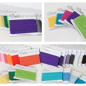 May include: Assortment of colorful elastic bands in various colors, including red, orange, yellow, green, blue, purple, pink, and brown. The elastic is packaged on cards with the text "Elastic by the Yard" and a website address.
