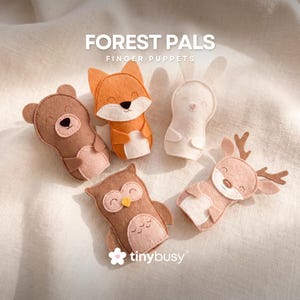 May include: Five felt finger puppets shaped like forest animals: a bear, fox, rabbit, owl, and deer. The puppets are in shades of brown, orange, and white, with embroidered details. The text "FOREST PALS FINGER PUPPETS" is at the top of the image.