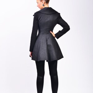 Back view showing the shaped seams, fitted waist, and flared hem