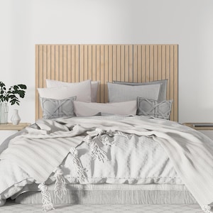 May include: A natural-colored bed with a wooden headboard, measuring 63 inches (160 cm) wide and 35 inches (90 cm) high. The bed is adorned with light-colored pillows and a textured blanket with tassels. Two small wooden side tables flank the bed.