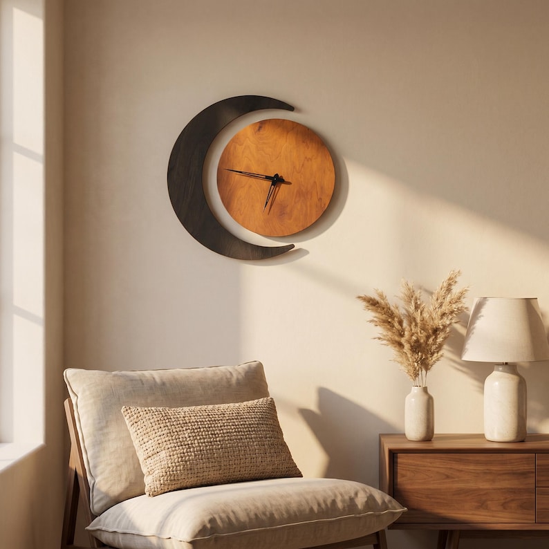 May include: A wall clock featuring a circular wooden face with a warm brown grain and black hands, partially framed by a dark, crescent-shaped wooden element. The clock is mounted on a plain wall above a chair and a wooden side table with a lamp.