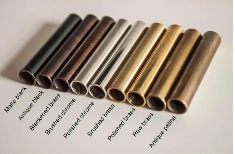 May include: An assortment of metal tubes in various finishes, including matte black, antique black, blackened brass, brushed chrome, polished chrome, brushed brass, polished brass, raw brass, and antique patina. The text labels each finish.
