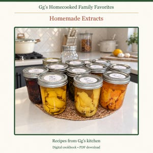 May include: A collection of glass mason jars filled with homemade extracts, each topped with a silver metal lid and a white label reading Gg's. The jars contain various ingredients like citrus peels and herbs, arranged on a round woven mat.