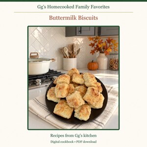 May include: A digital cookbook titled Gg's Homecooked Family Favorites Buttermilk Biscuits, featuring a stack of golden-brown baked biscuits on a black plate, with text at the bottom reading Recipes from Gg's kitchen and Digital cookbook PDF download.