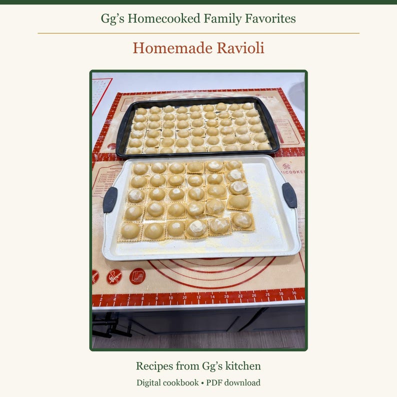 May include: A digital cookbook titled Gg's Homecooked Family Favorites: Homemade Ravioli. The image displays two rectangular baking sheets filled with rows of raw, square-shaped ravioli, resting on a silicone baking mat with measurement markings.