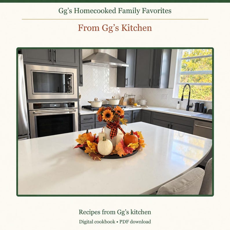 May include: A digital cookbook titled Gg's Homecooked Family Favorites and From Gg's Kitchen. The cover features a kitchen island with a centerpiece of sunflowers, pumpkins, and candles, set against dark cabinets and stainless appliances.