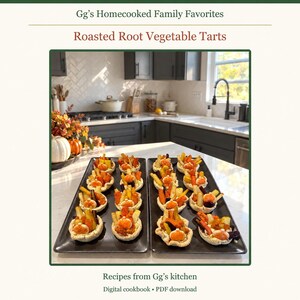 May include: A digital cookbook titled Gg's Homecooked Family Favorites featuring Roasted Root Vegetable Tarts. The cover displays two rectangular black platters holding small pastry tarts topped with roasted carrots and squash.