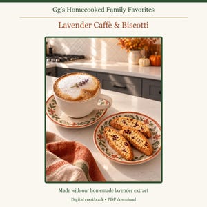 May include: A digital cookbook titled Gg's Homecooked Family Favorites: Lavender Caff&egrave; & Biscotti. The image shows a white coffee cup with foam and a lavender sprig on a floral saucer, next to a plate of biscotti and a striped cloth.