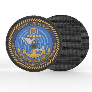 May include: A round patch featuring the words "ARMADA DE MEXICO" and "COORDINADORA GENERAL DEL CIBERESPACIO". The patch has a blue and gold design with an anchor, a map of Mexico, and a padlock. The patch is black on the back.