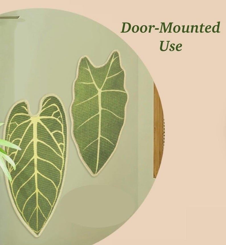 May include: Two green leaf-shaped decorative items with light green veins and a beige border are mounted on a light green surface. The text "Door-Mounted Use" is displayed in dark green. The items are likely for home decor.